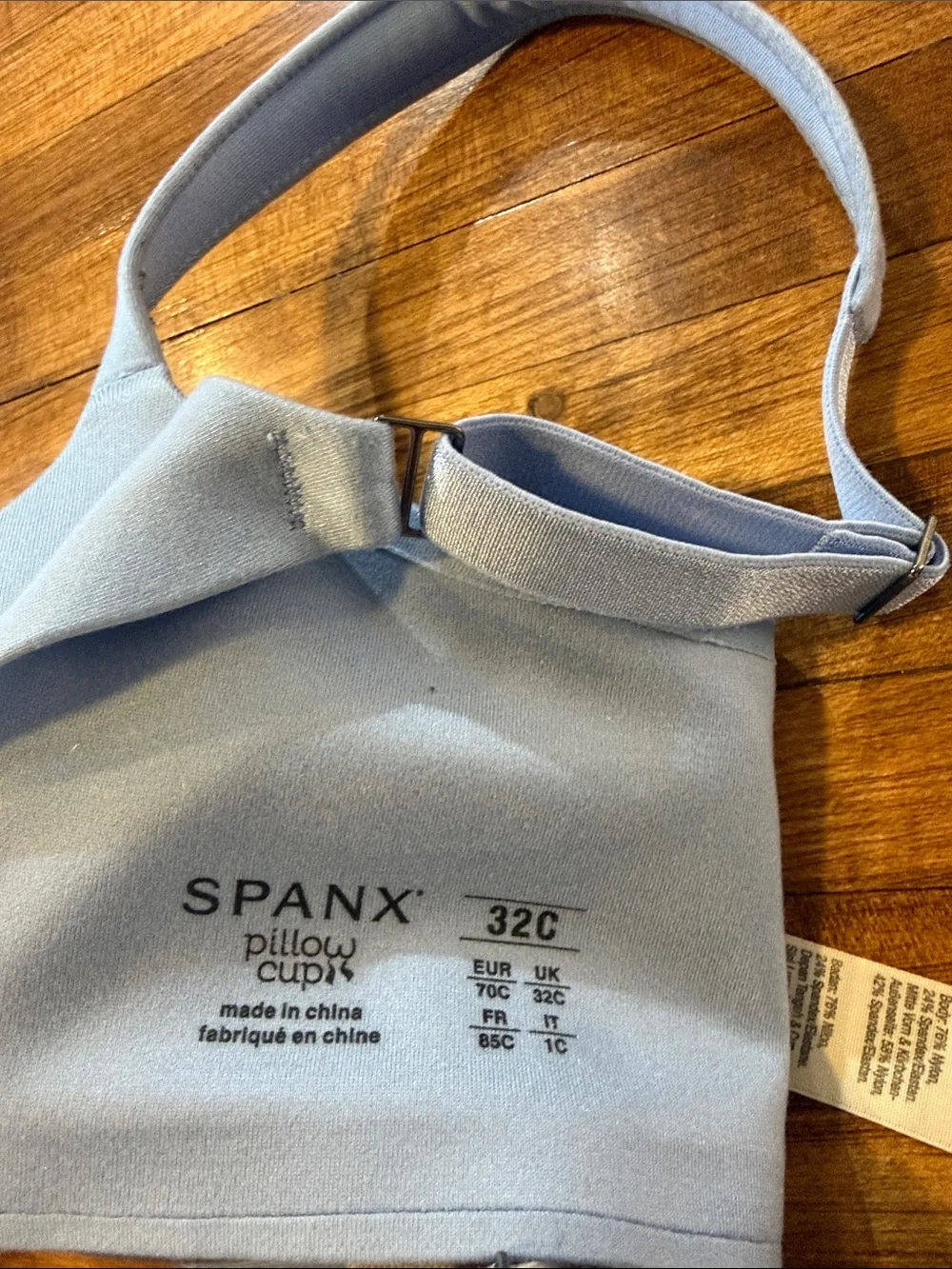 Three-pack SPANX Smooth T-Shirt Bras in Light Blue, Cream, and Red